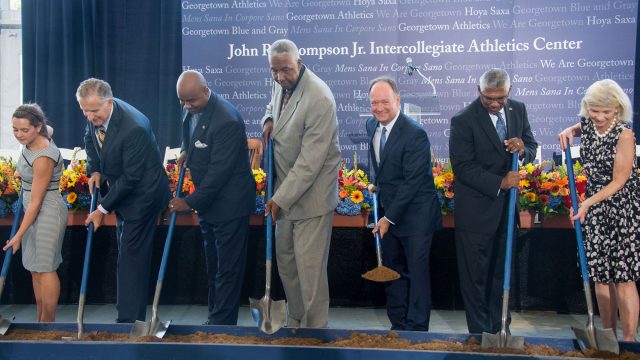 Alumni donors and other members of the Georgetown community join John Thompson Jr. and Georgetown President John J. DeGioia with shovels for the ground-breaking.