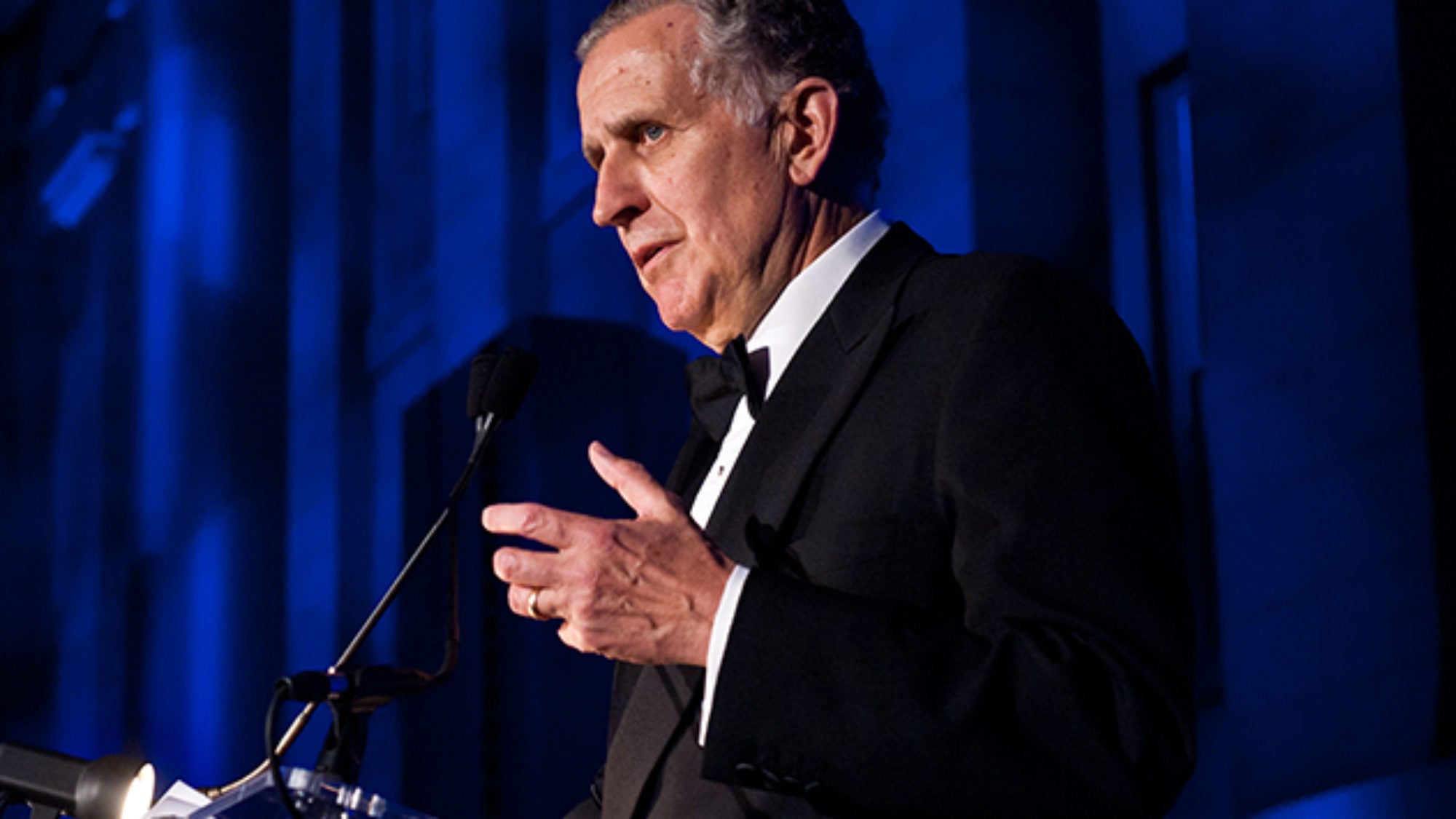 Paul Tagliabue speaking into microphone