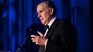 Paul Tagliabue speaking into microphone
