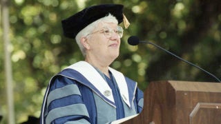 Vera Rubin at a podium wearing cap and gown