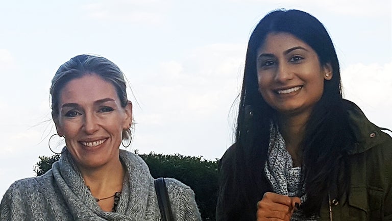 Abigail Marsh and Kruti Vekaria smiling and standing next to each other.