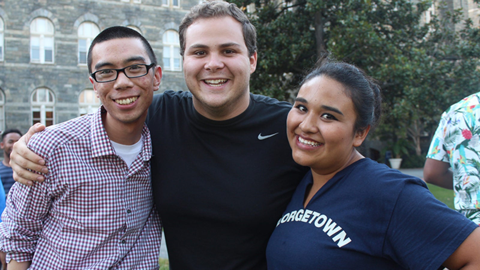 Three Georgetown students smile for the camera.