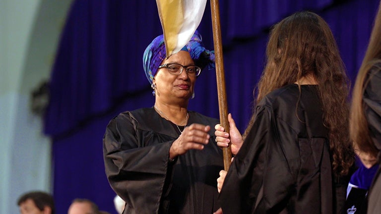 Melisande Short-Colomb holding flag