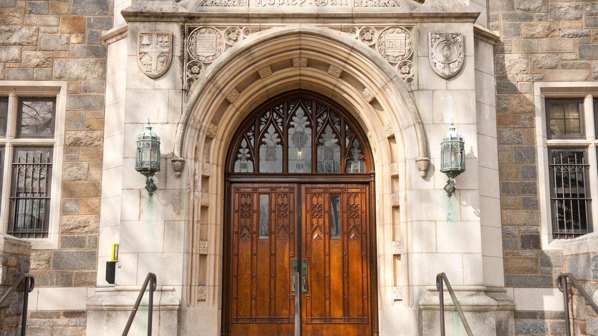 Arched wooden door on an old looking building