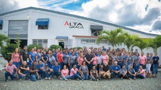 A large group of workers in front of the Alta Garcia apparel plant