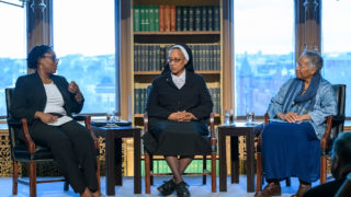 Marcia Chatelain, Marcia Hall and Diane Batts Morrow sit on stage and talk during a panel discussion.