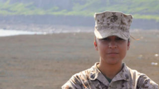 Jennifer Esparza wearing military fatigues in a desert area