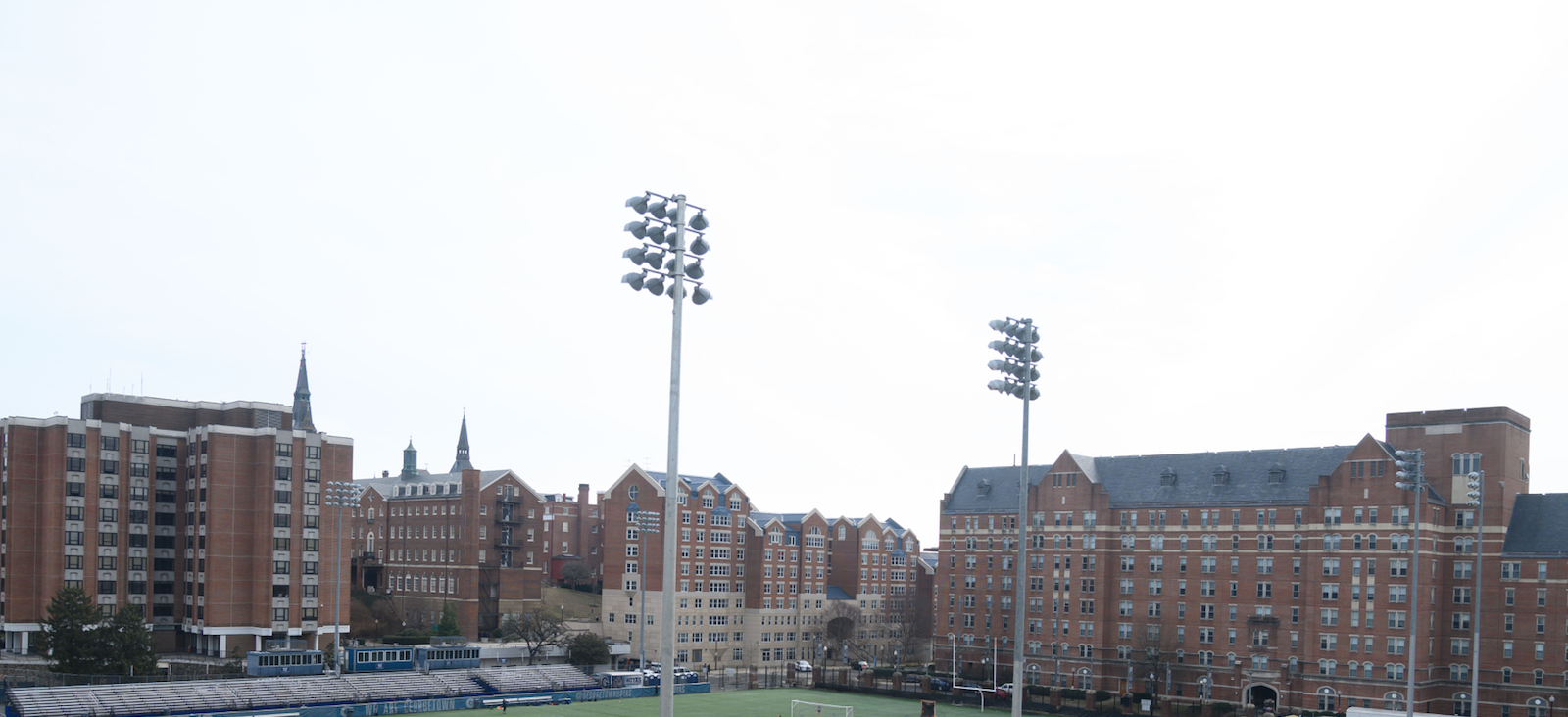 Lights loom over Cooper Field on a sunny day