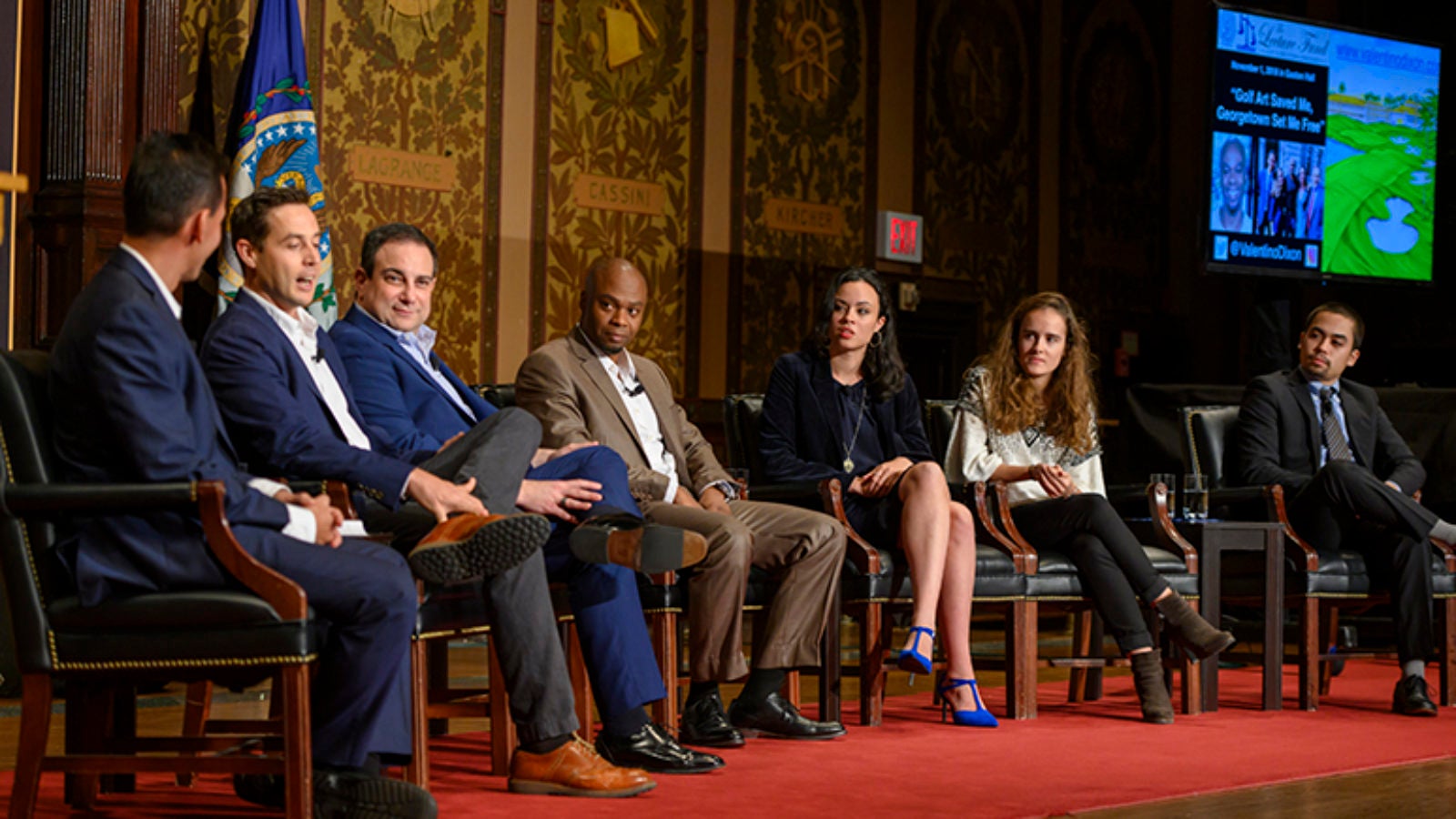 Marc Howard, Max Adler, Valentino Dixon, Isobella Goonetillake, Julie Fragonas and Naoya Johnson sitting onstage in Gaston Hall