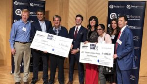 Shavini Fernando with students and Ted Leonsis helping hold oversized checks