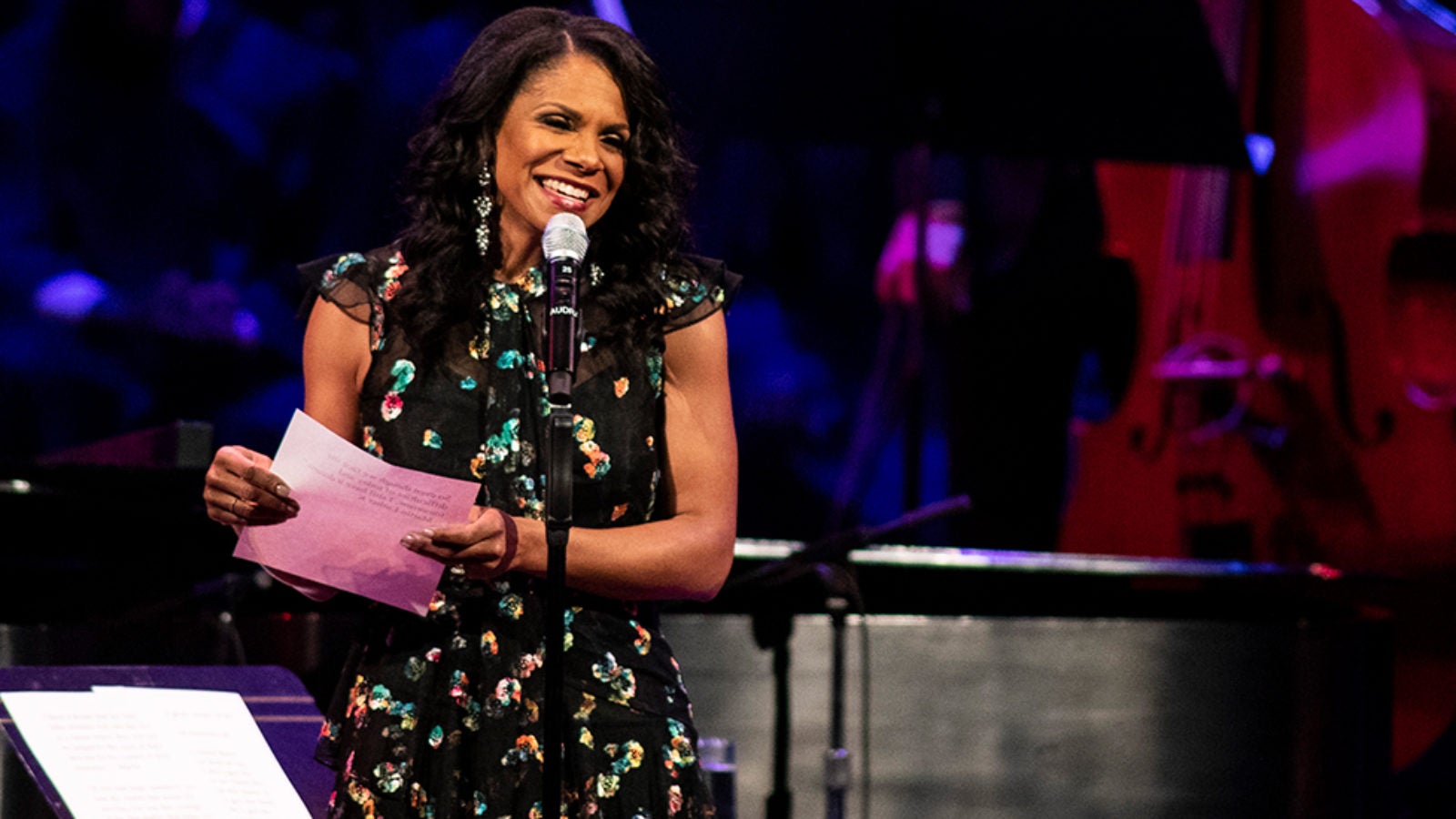 Audra McDonald speaks to the audience from the stage.