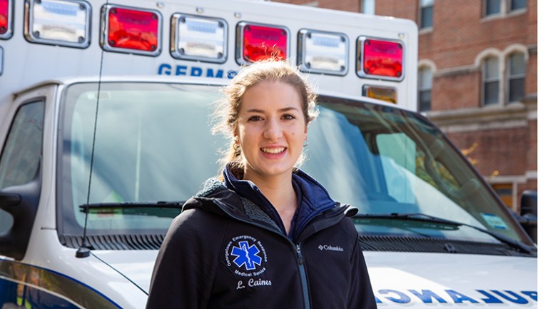 Lindsey Caines in front of a GERMS ambulance