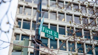 Photograph showing a building with the street sign reading First Street 500