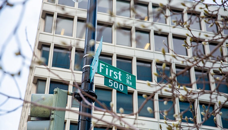 Photograph showing a building with the street sign reading First Street 500