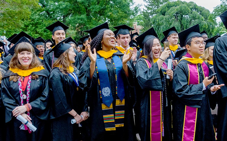 Students in caps and gowns at graduation