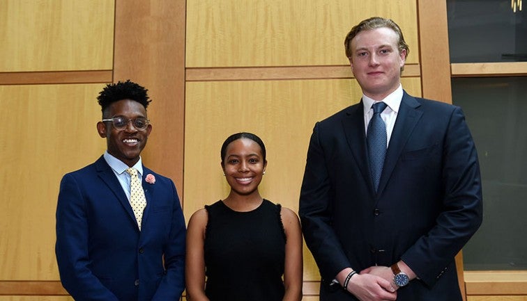 Kendell Long, Taylor Riddick and Alex Buffone standing