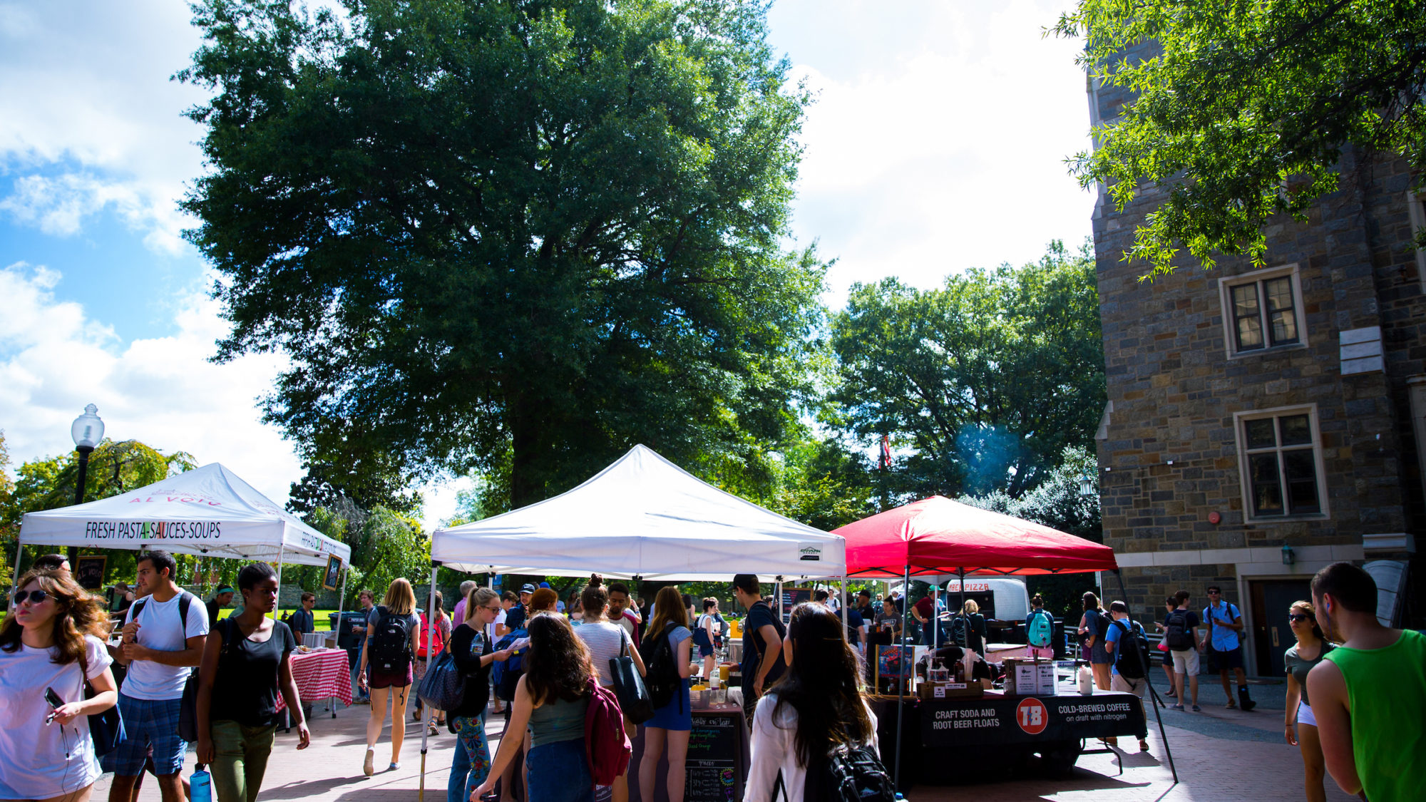Local food vendors set up tents on campus to offer dishes to students during the weekly Farmer&#039;s Market.