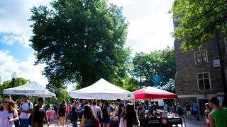 Local food vendors set up tents on campus to offer dishes to students during the weekly Farmer&#039;s Market.
