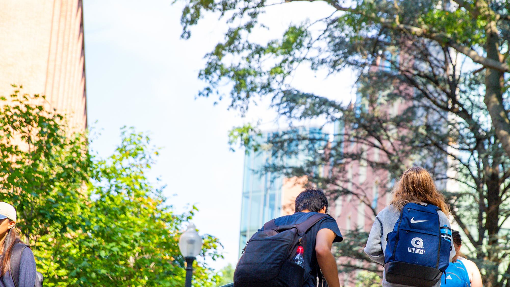 Students walk along a corridor outside Pedro Arrupe Hall.