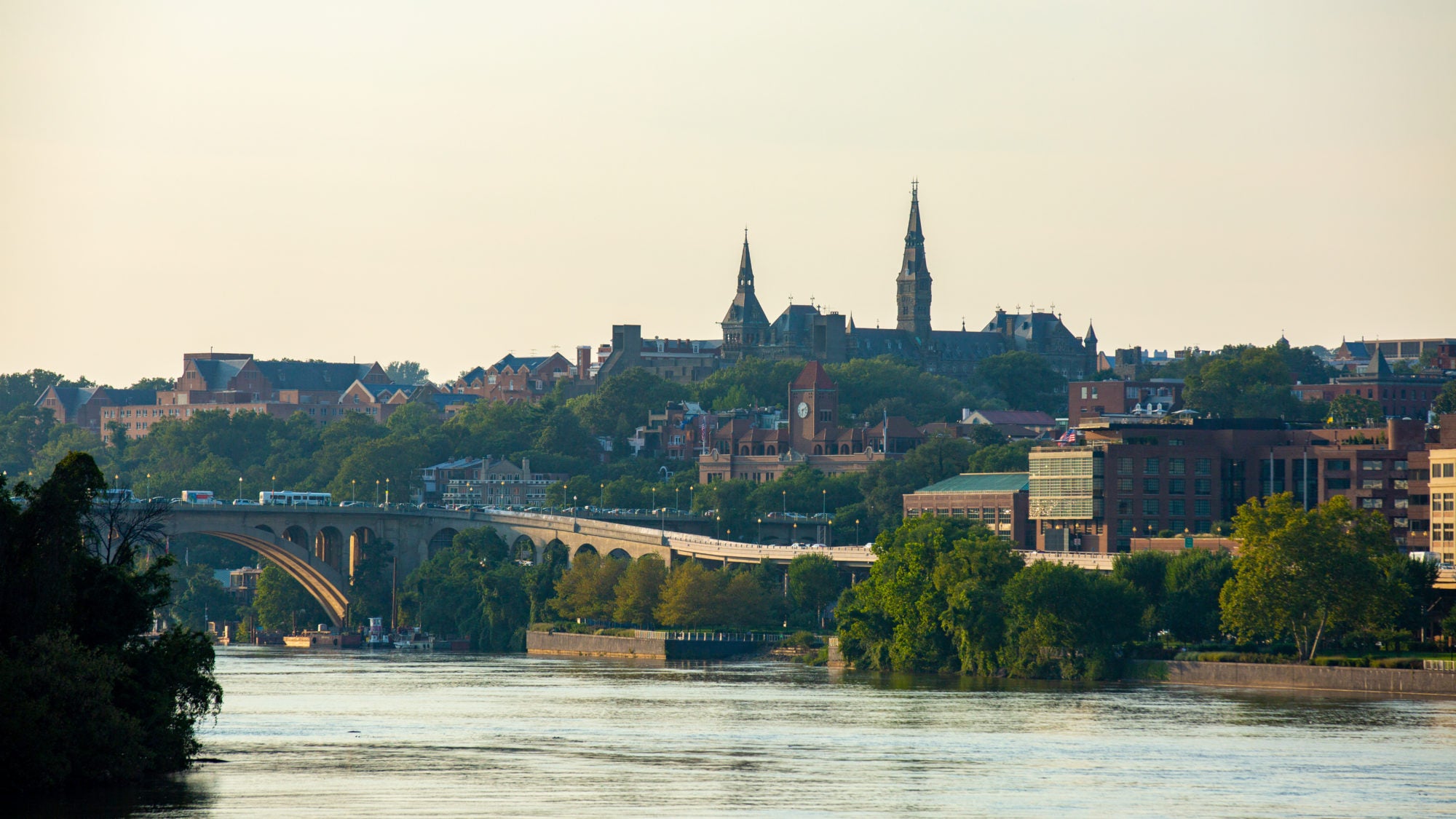 Georgetown is framed in the photo on the waterfront during sunset.