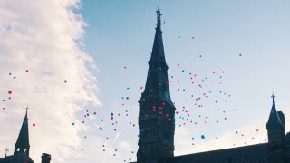 Balloons float over Healy Hall