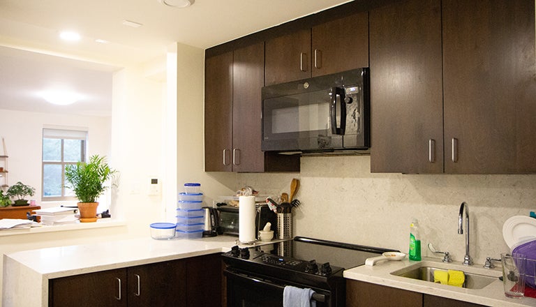 Kitchen with tupperware and cooking equipment