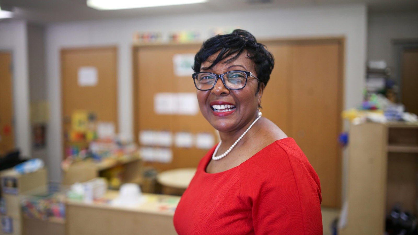 Sandra Jackson standing in front of some desks