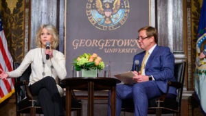 Jane Fonda and Pete Mara sit down on stage and talk to the audience.