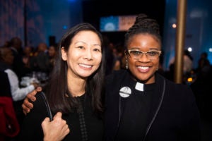 Heidi Tseu and Ebony Grisom stand together while smiling.