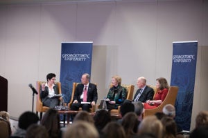 Desha Girod, Ban Ki-Moon, Mary Robinson, Jerry Brown and Rachel Bronson sits on a stage with Georgetown University banner behind them