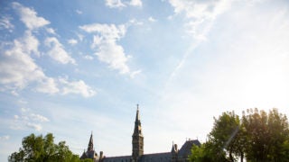 Healy Hall with trees around it.