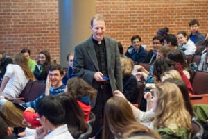 Matthew Carnes teaching, surrounded by students