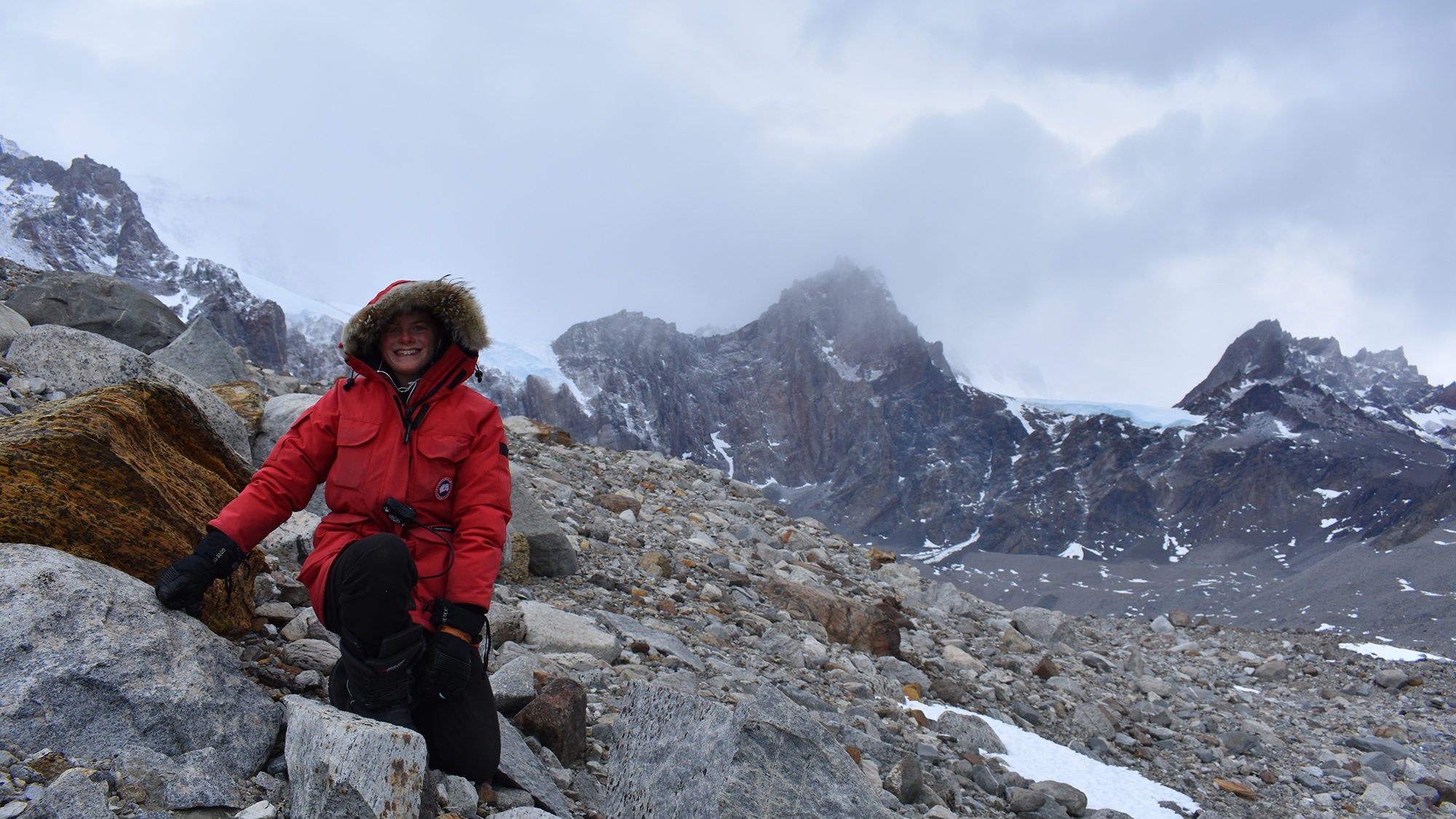 Mia Vandervilt wearing a winter parka on top of a mountain