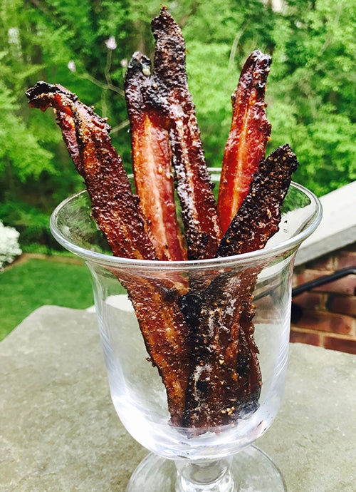 Bacon sticking up in a glass container