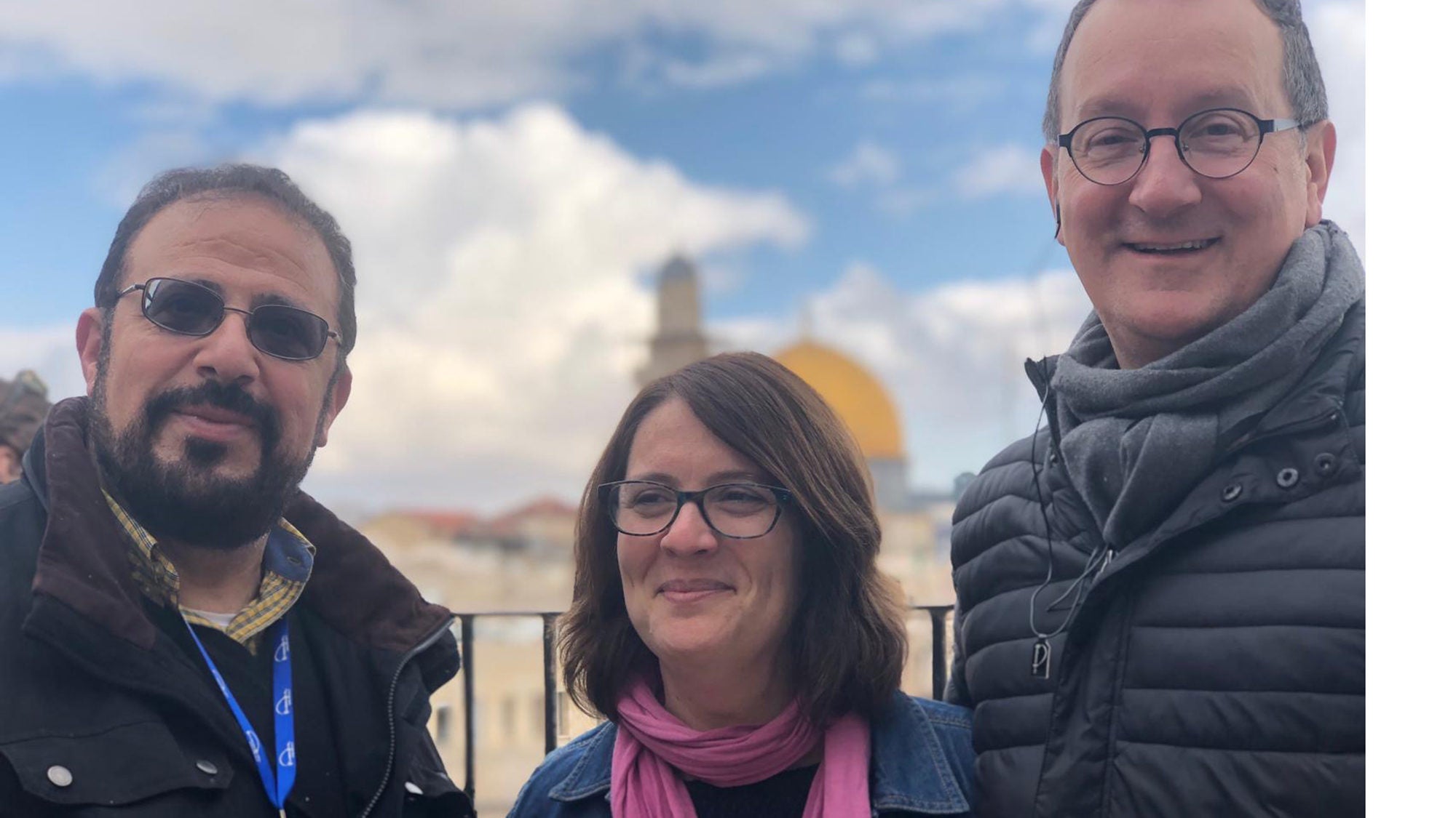 Yahya Hendi, Rachael Gartner and Mark Bosco in front of the Dome of the Rock in the Holy Land