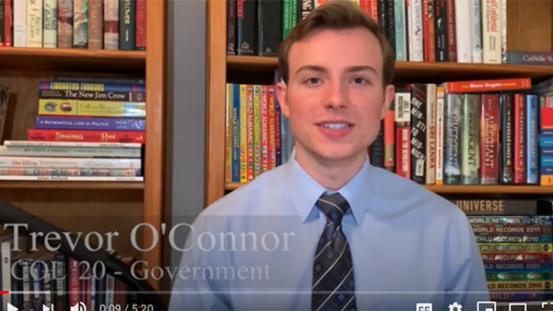 Trevor O&#039;Connor in front of a bookcase