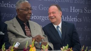 John Thompson Jr. sits with John J. DeGioia as they share a laugh.