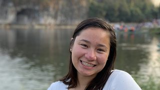 Cate Paterson outside in front of a lake