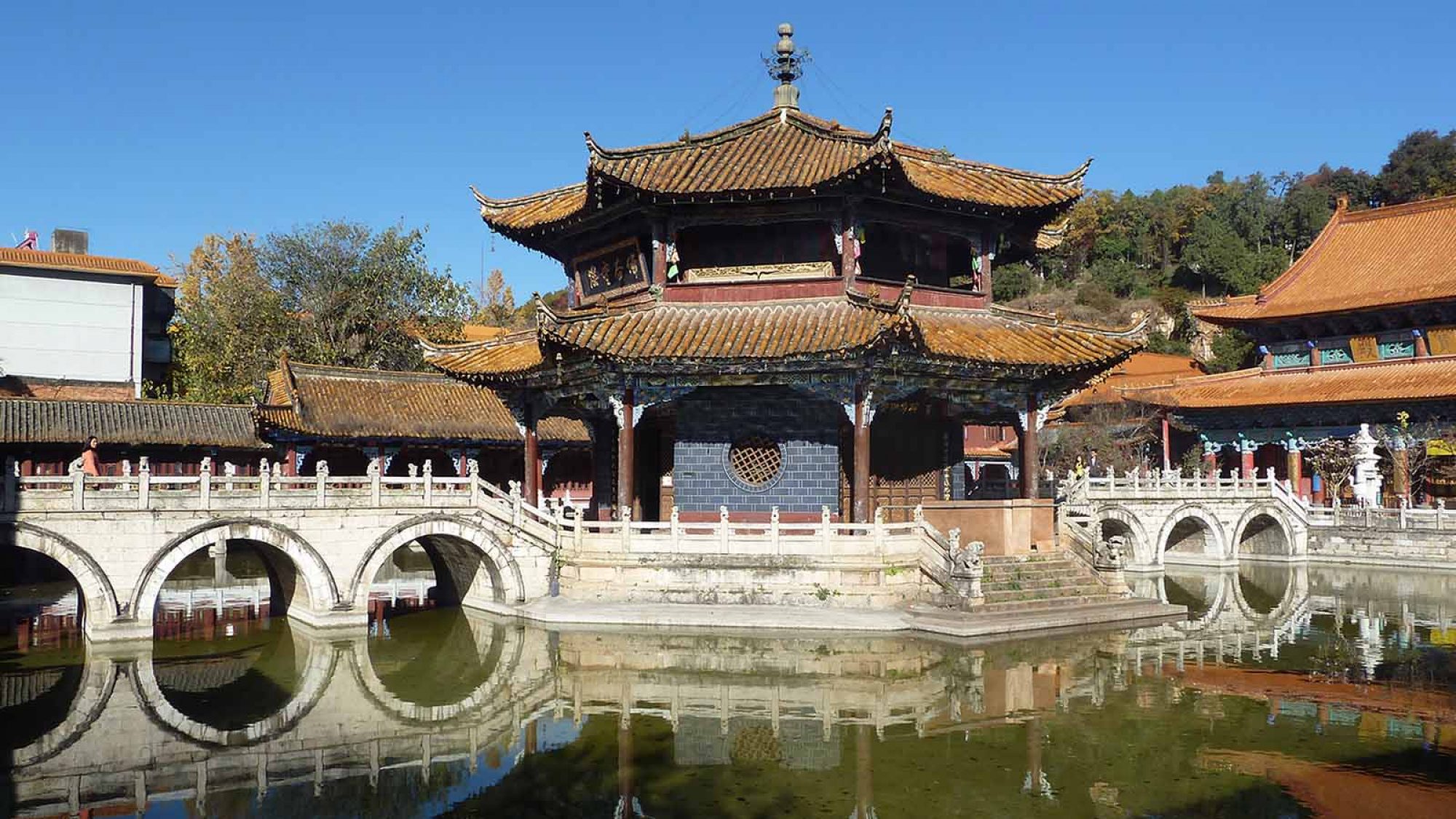 Yuantong Temple surrounded by water with a bridge