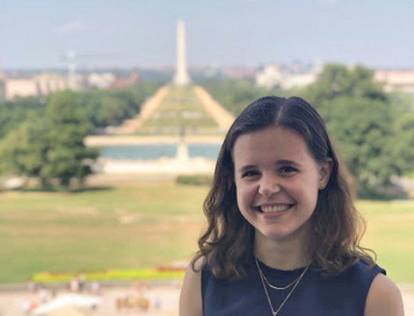 Sarah Bryant outside with Washington Monument in background