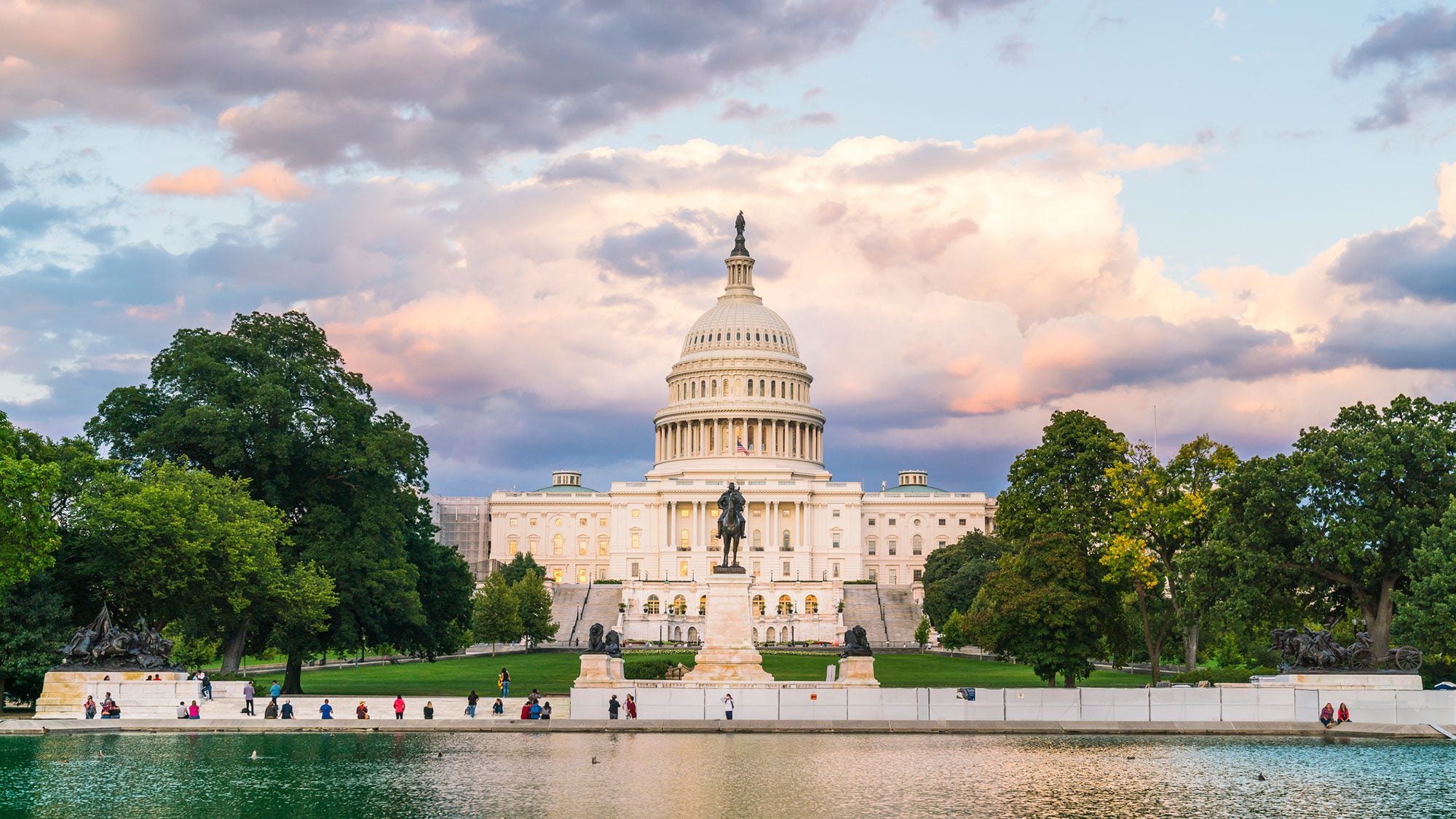 Capitol Building with clouds behind it at sunset