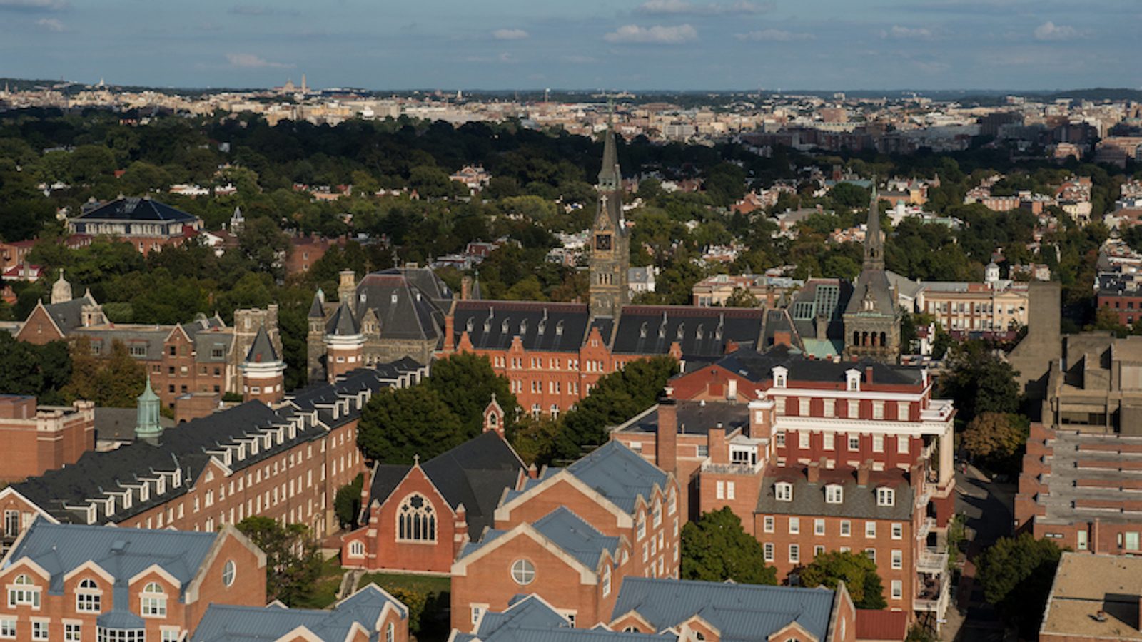 An aerial photograph of Georgetown University including the clock tower of Healy Hall