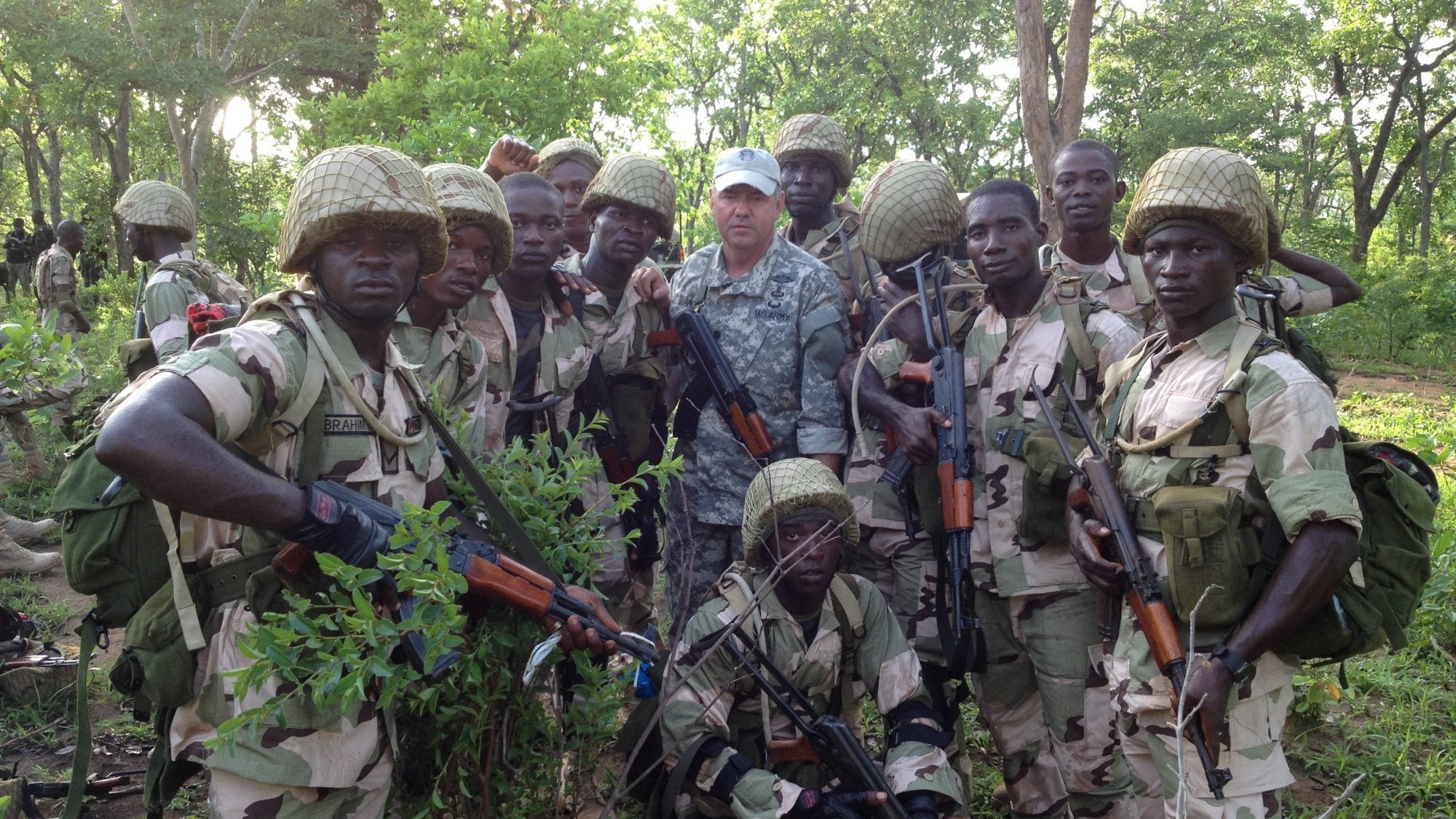 A California National Guard Special Forces soldier poses with Nigerian soldiers in 2014 during a training mission in Nigeria.