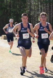 The men's cross country team runs during competition.