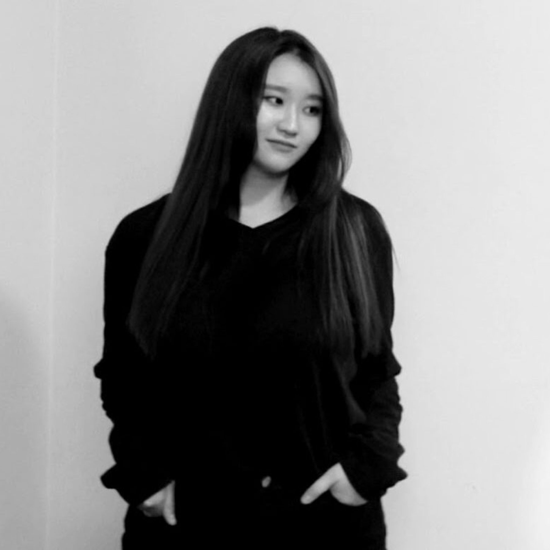 Black and white photo of Irene Chun with her hands in her pocket