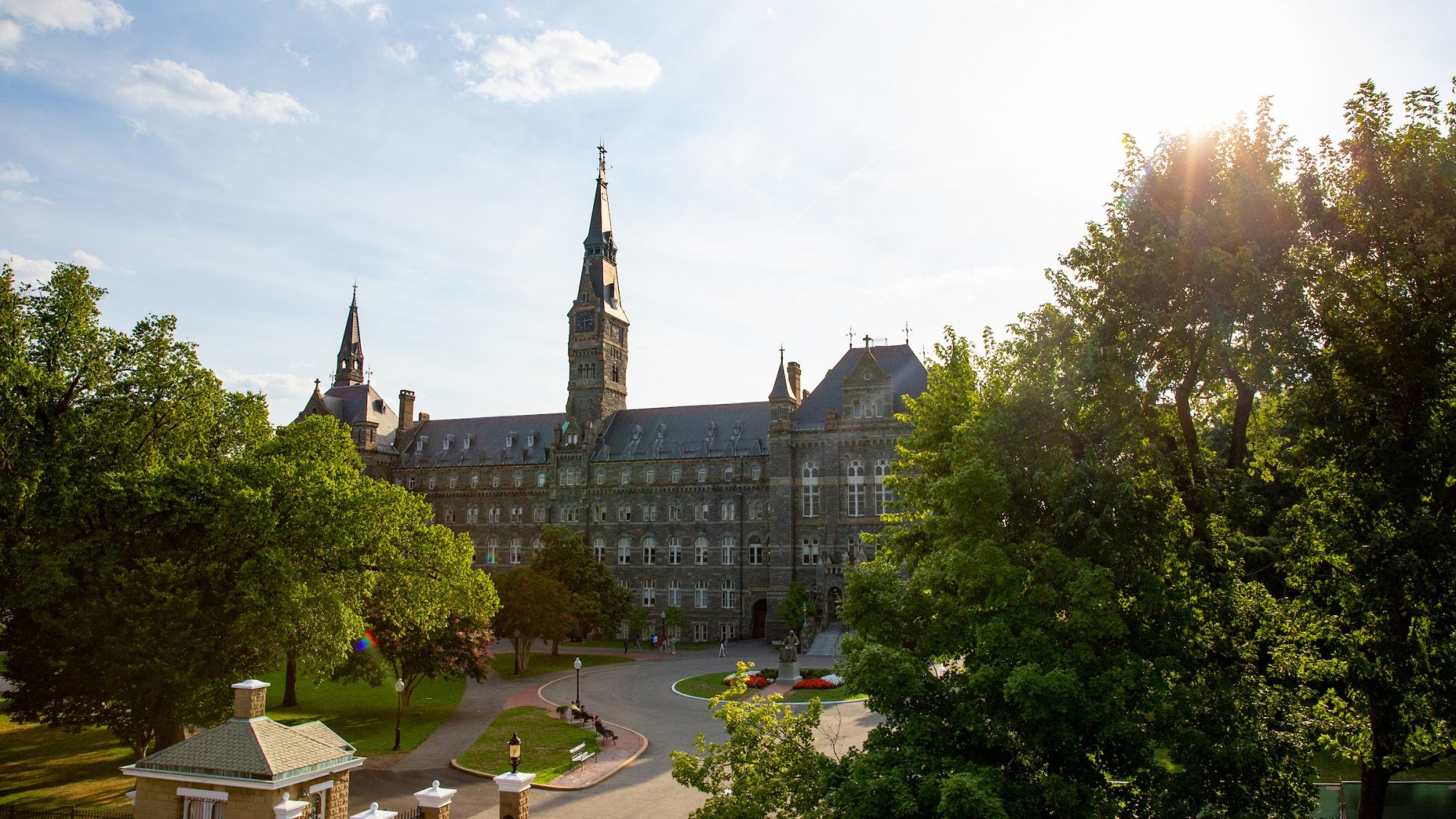 Sun shines on Healy Hall from a distance