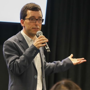 David McLaughlin speaks at a microphone