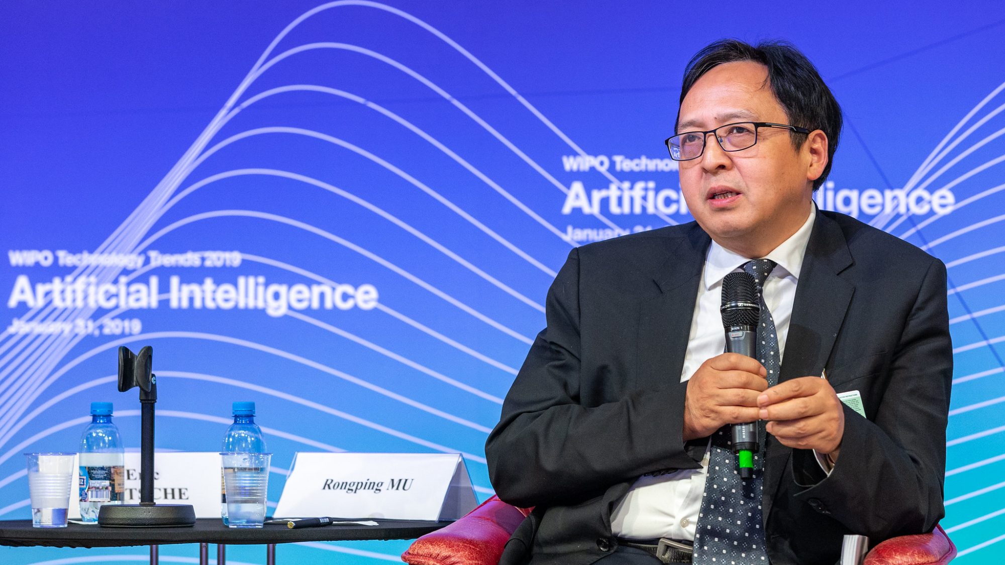 Rongping Mu, Head of the Institutes of Sciences and Development in China, speaks at a panel discussion on artificial intelligence