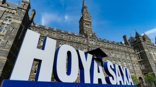 Large letters reading &quot;Hoya Saxa&quot; in front of Healy Hall