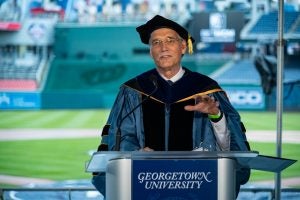 Provost Groves speaks from a podium at Nats Park